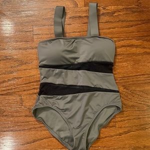 Cami green with dope mesh design one piece bathing suit. Sporty and sexy. New